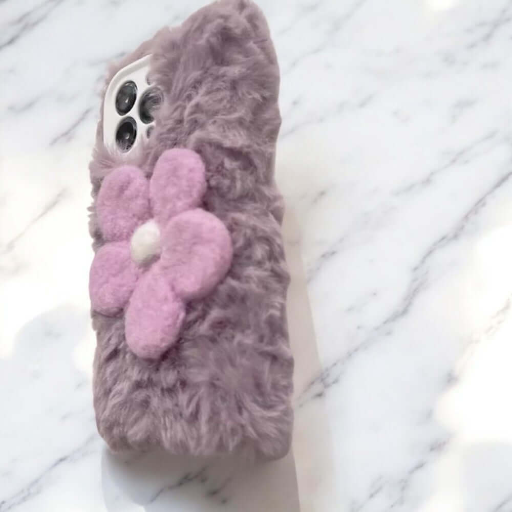 a cell phone case with a flower on it