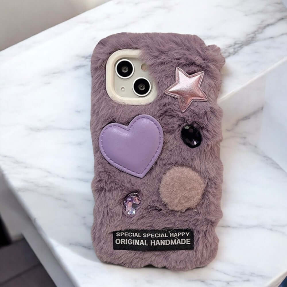 a purple phone case with a heart and a star on it