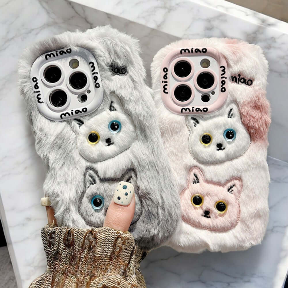 a pair of phone cases with cats on them