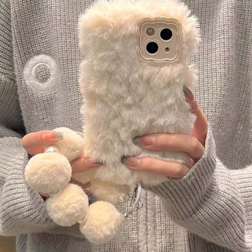 a woman holding a stuffed animal phone case