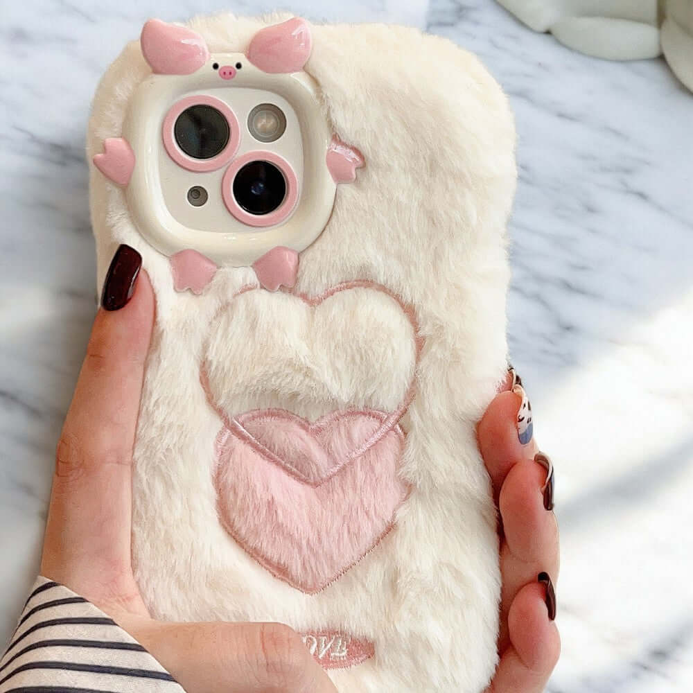 a person holding a phone case with a heart on it