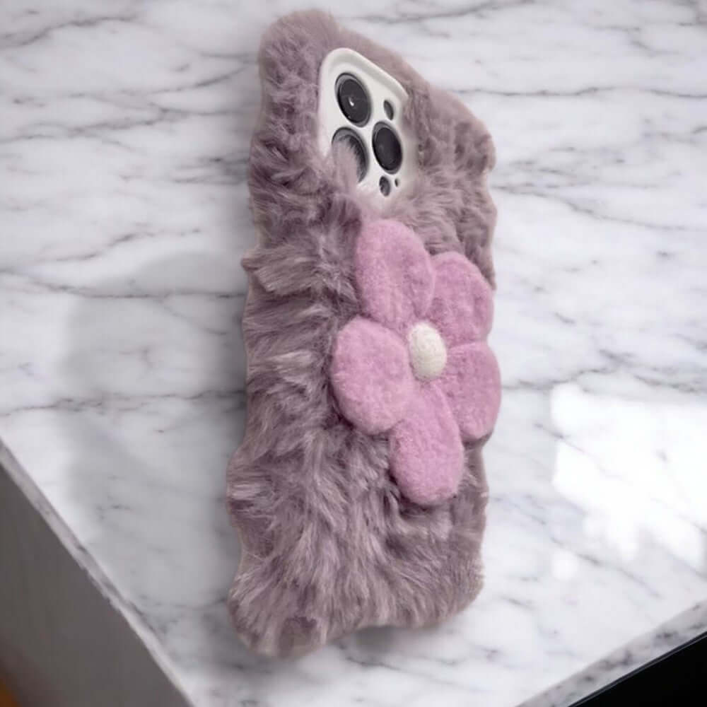 a cell phone case with a flower on it