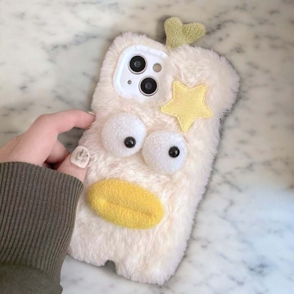 a person holding a phone case with a stuffed animal on it