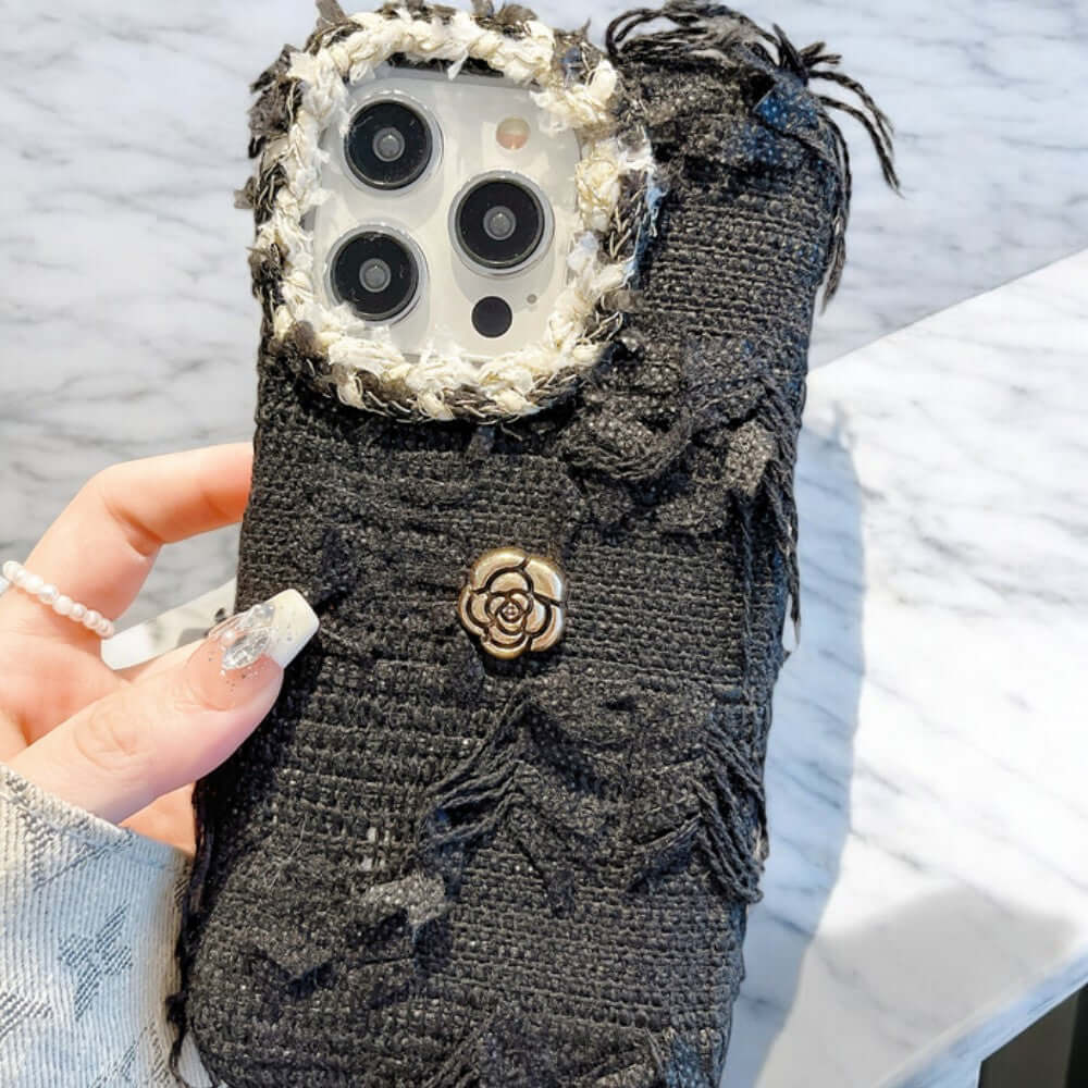 a person holding a cell phone case with buttons on it