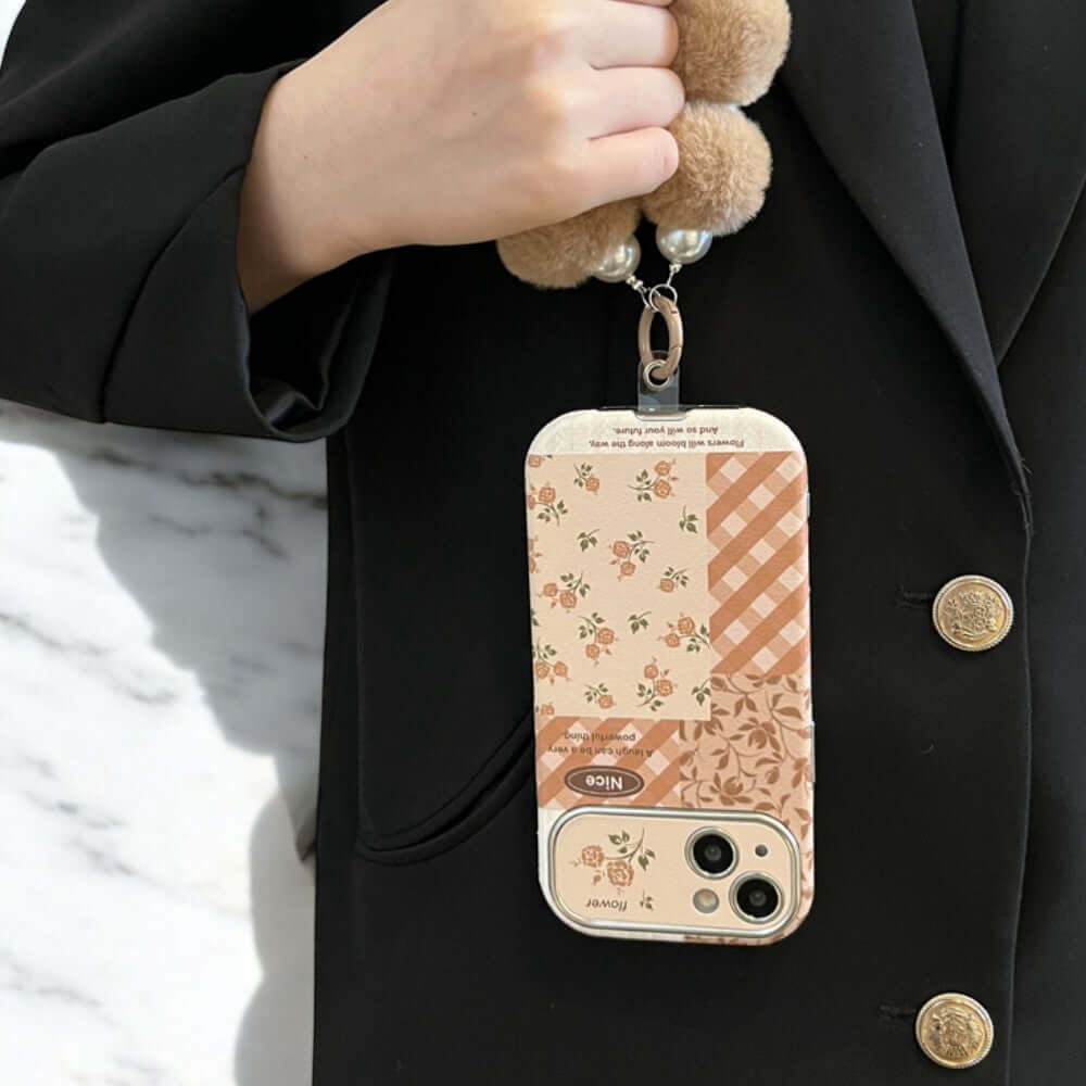 a person holding a teddy bear in a cell phone case